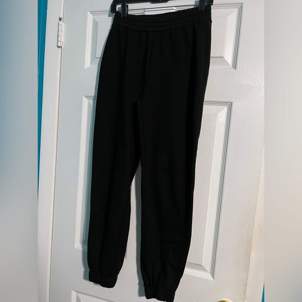 I am selling black sweatpants with no pockets from Rainbow.